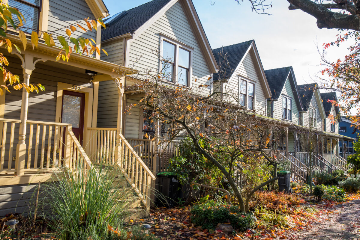 Row of townhouses in the fall on a sunny day.